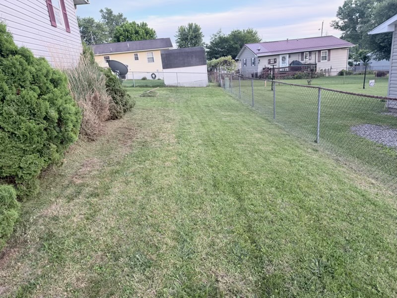 Freshly mowed residential lawn with clean cut lines